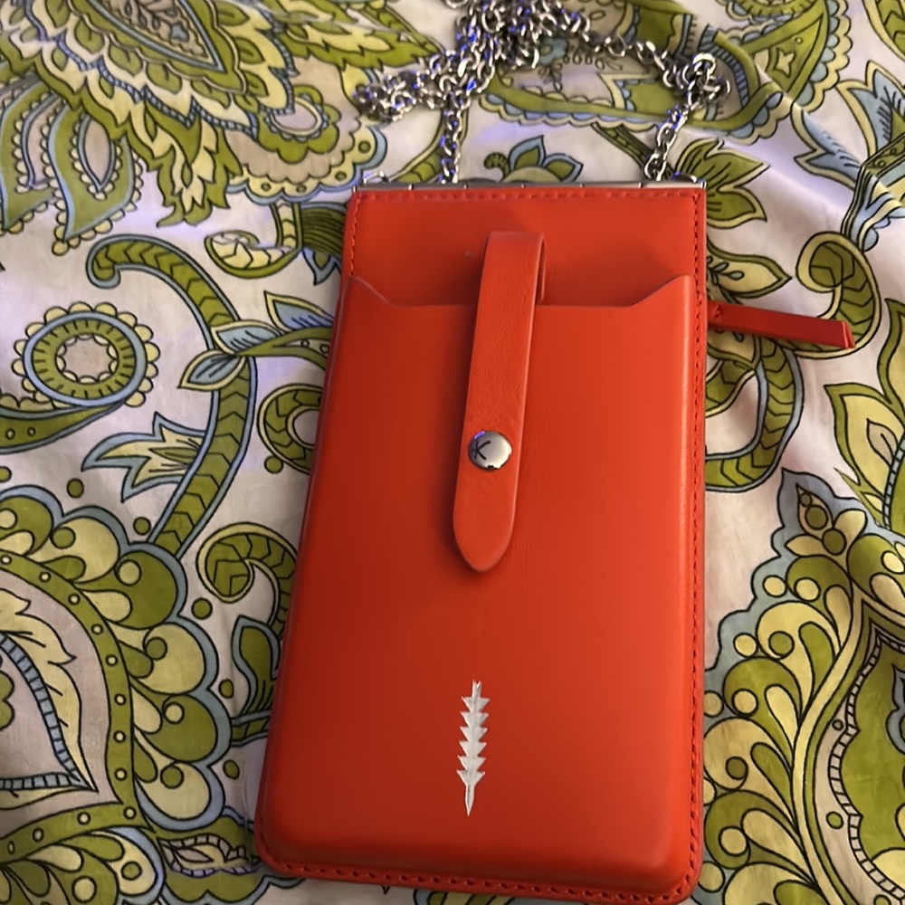 Thacker Nora phone crossbody. . Color: chili/ shiny nickel chain strap.